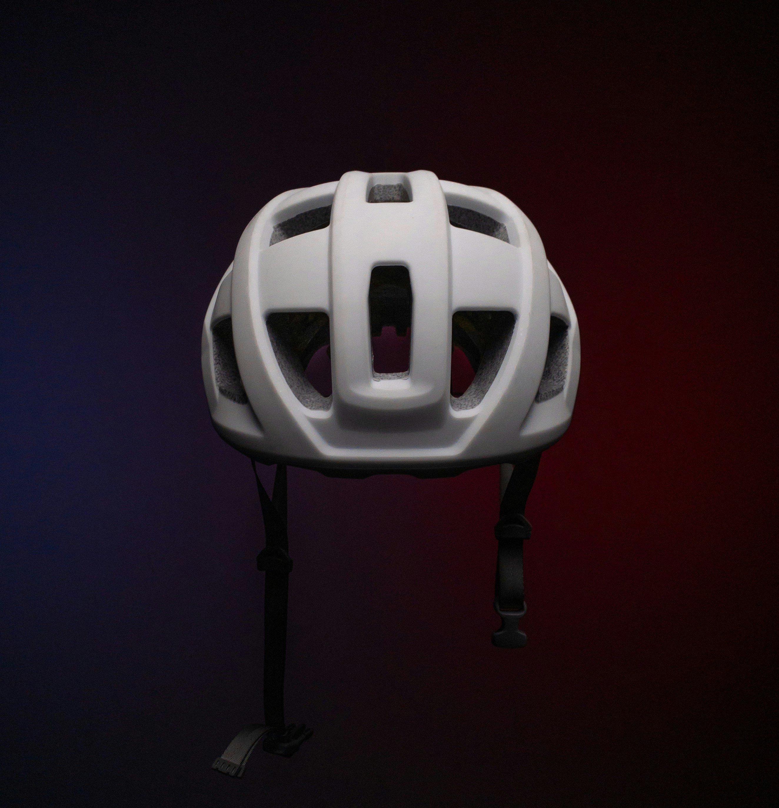 White water sports helmet on neutral grey background