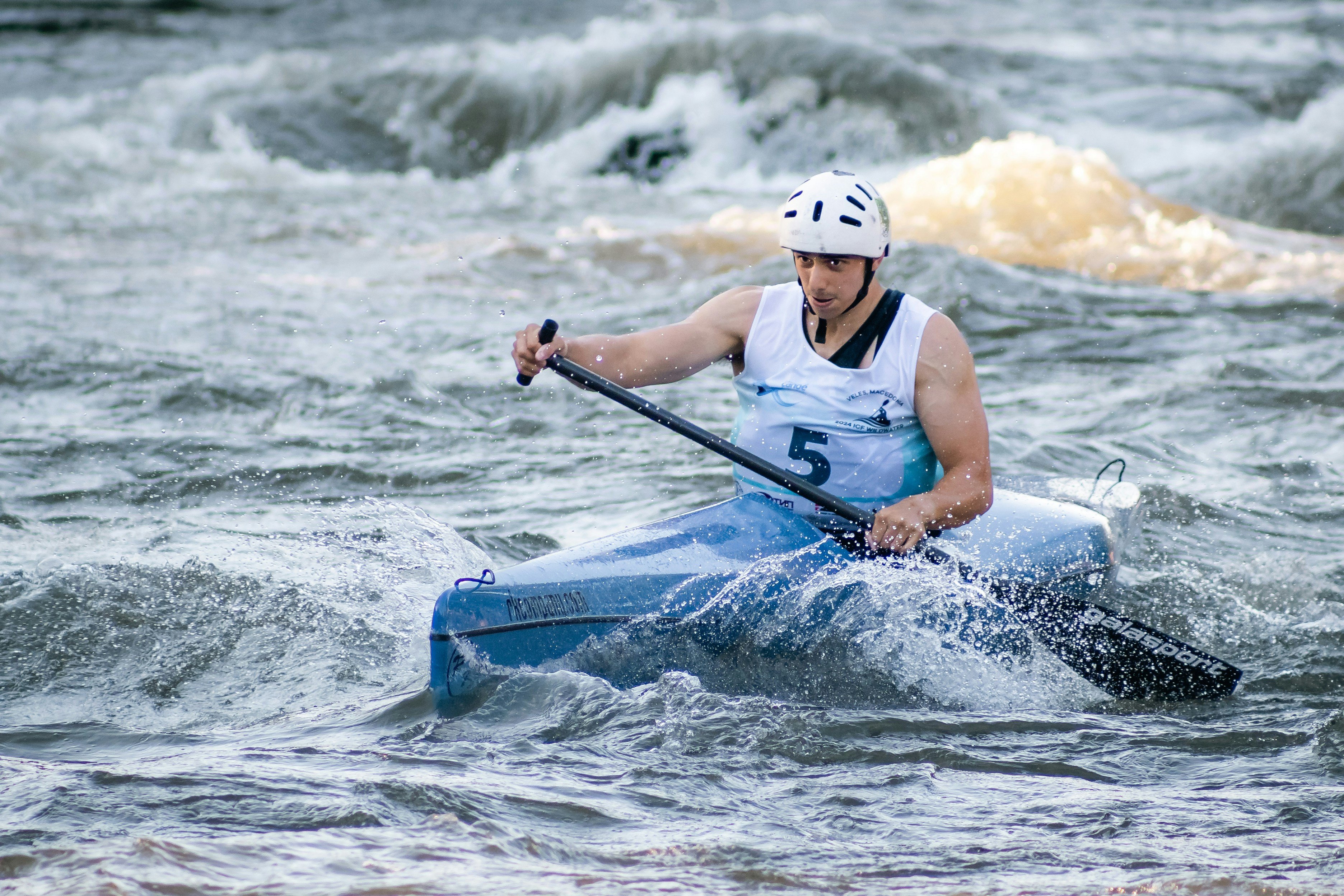 White water sports helmet on neutral grey background